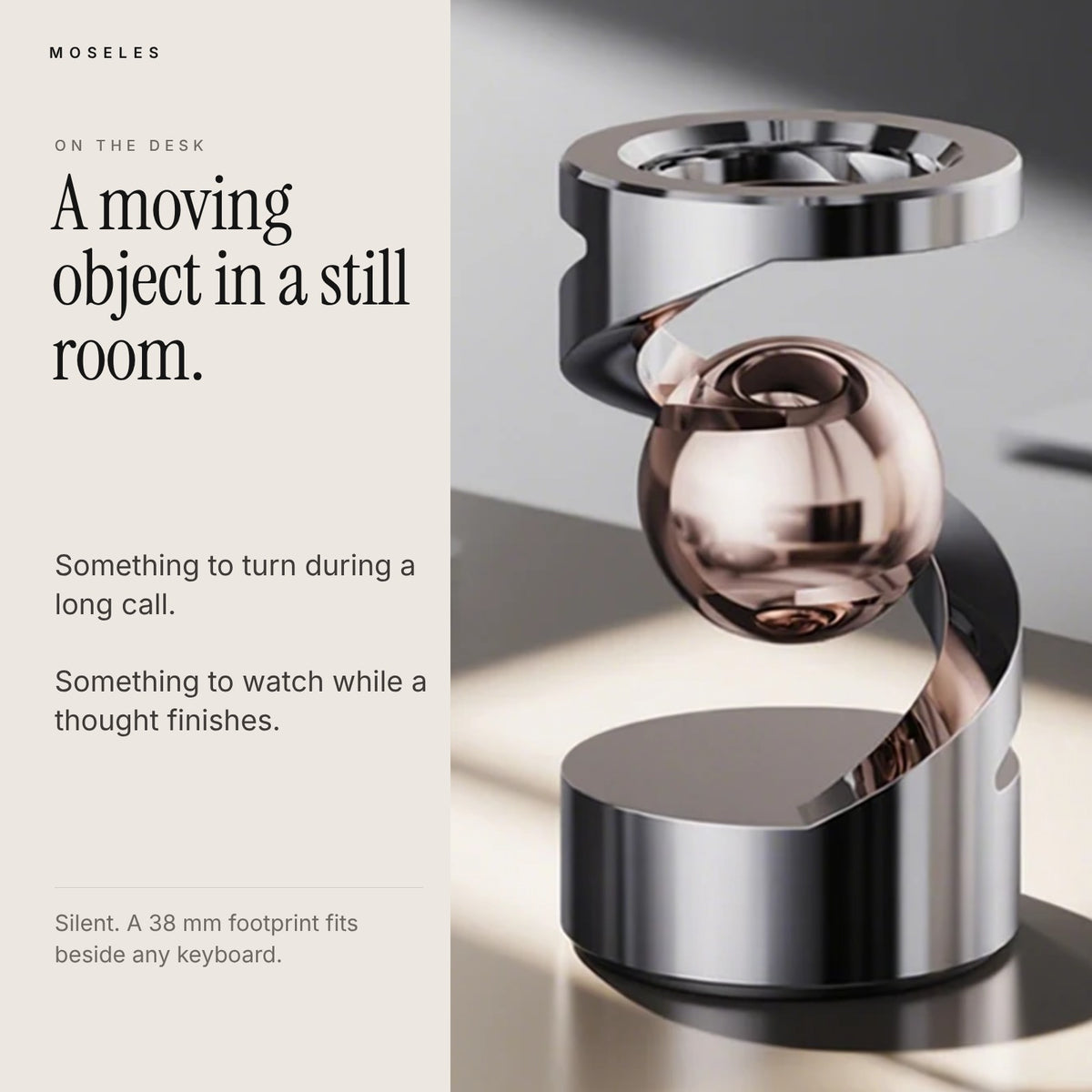 Levitation spinner with rose gold sphere on a sunlit desk