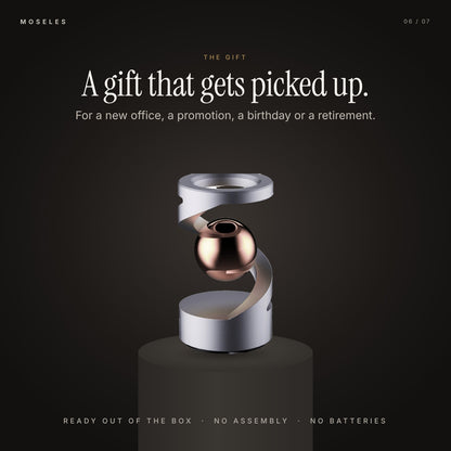 Levitation spinner in Gray Rose Gold on a dark plinth, shown as a gift